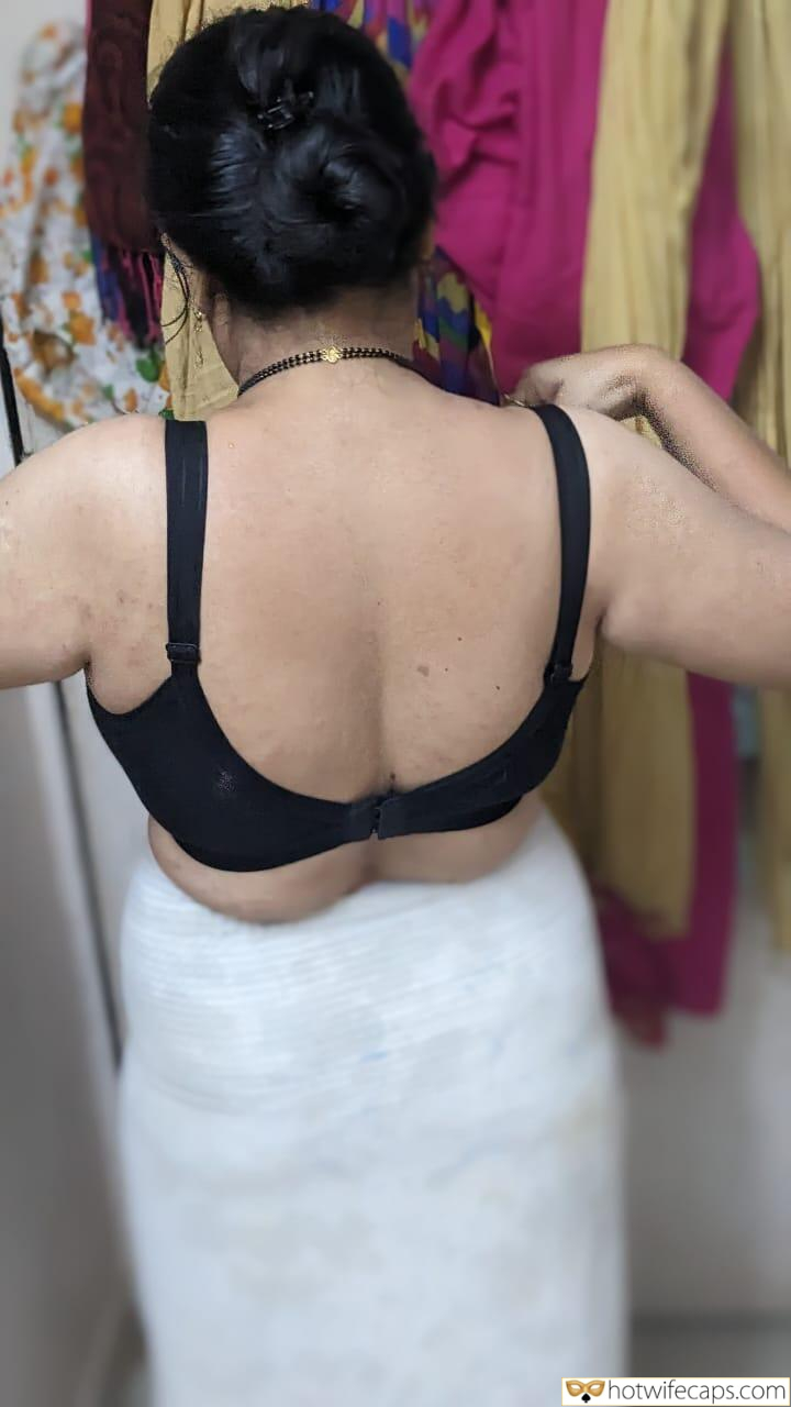 Wife Sharing No Panties It's too big Flashing Dogging Dirty Talk Cum Slut Anal hotwife caption: A private moment captured in a bustling marketplace, featuring a wife adjusting her bra, surrounded by colorful sarees and the whispers of tradition. Indian Wife Adjusting Her Bra in Private