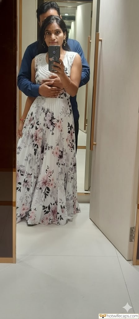 Wife Sharing Submitted by Users 🔥 Humiliation Cuckold Stories hotwife caption: A woman takes a mirror selfie in a modern hallway, capturing her husband's reflection behind her. The scene highlights a power dynamic where she asserts cont... Mirrored Desires: A Hallway Encounter